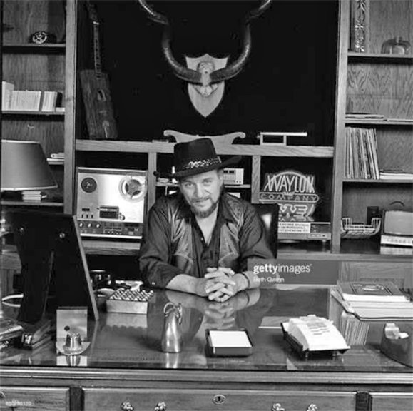 Waylon Jennings with a Teac reel tape recorder